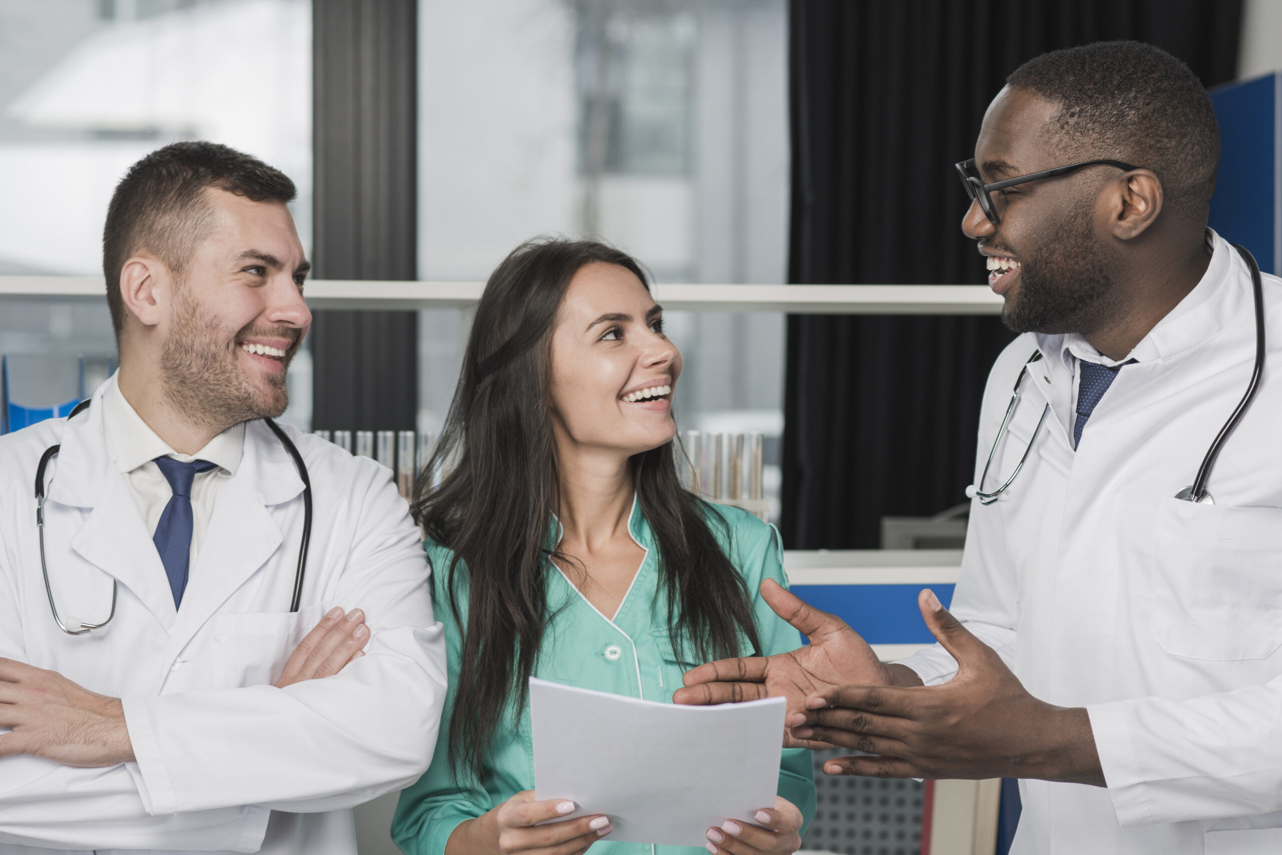 happy-multiethnic-doctors-with-document